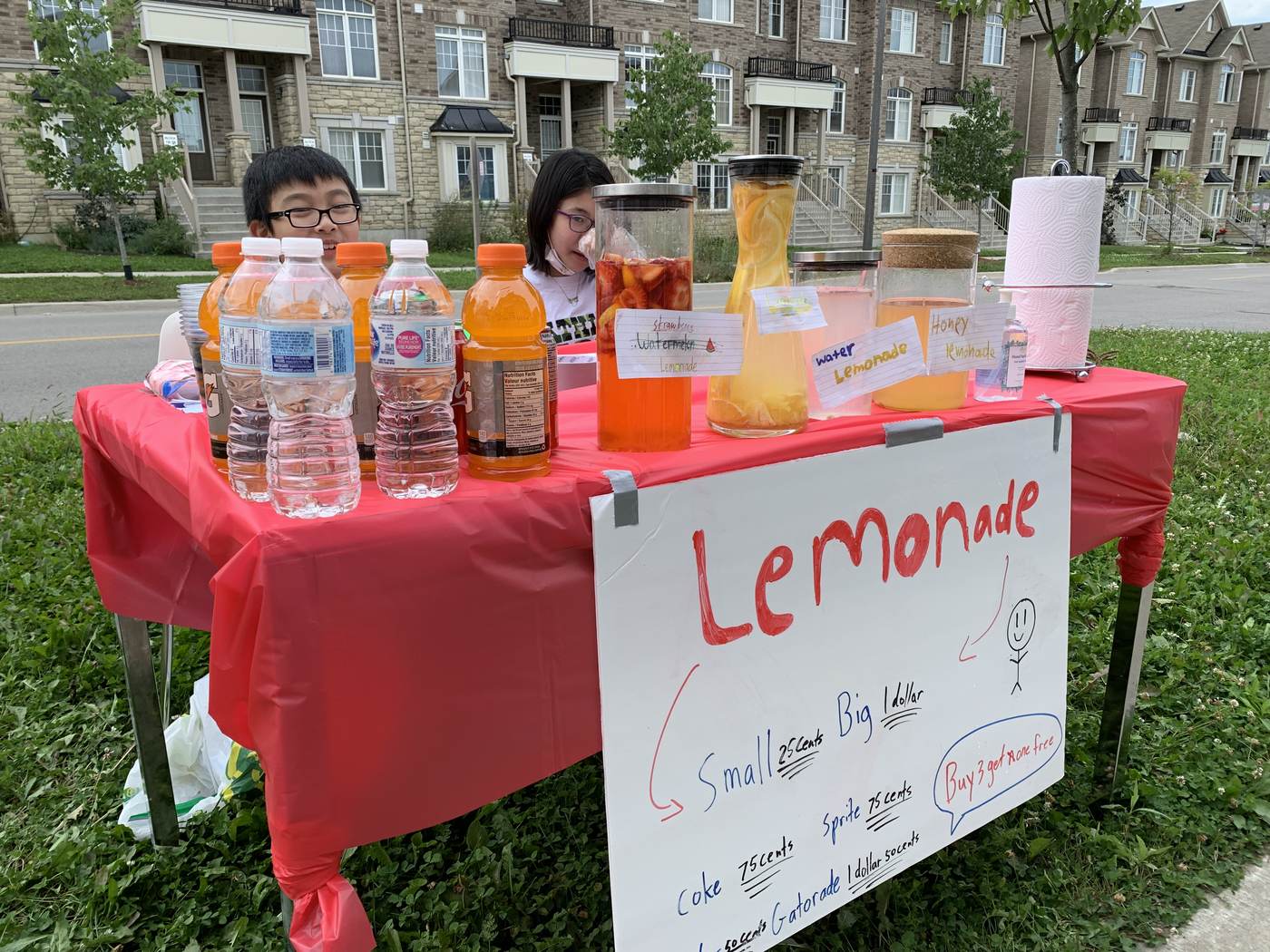Kids running their own lemonade stand
