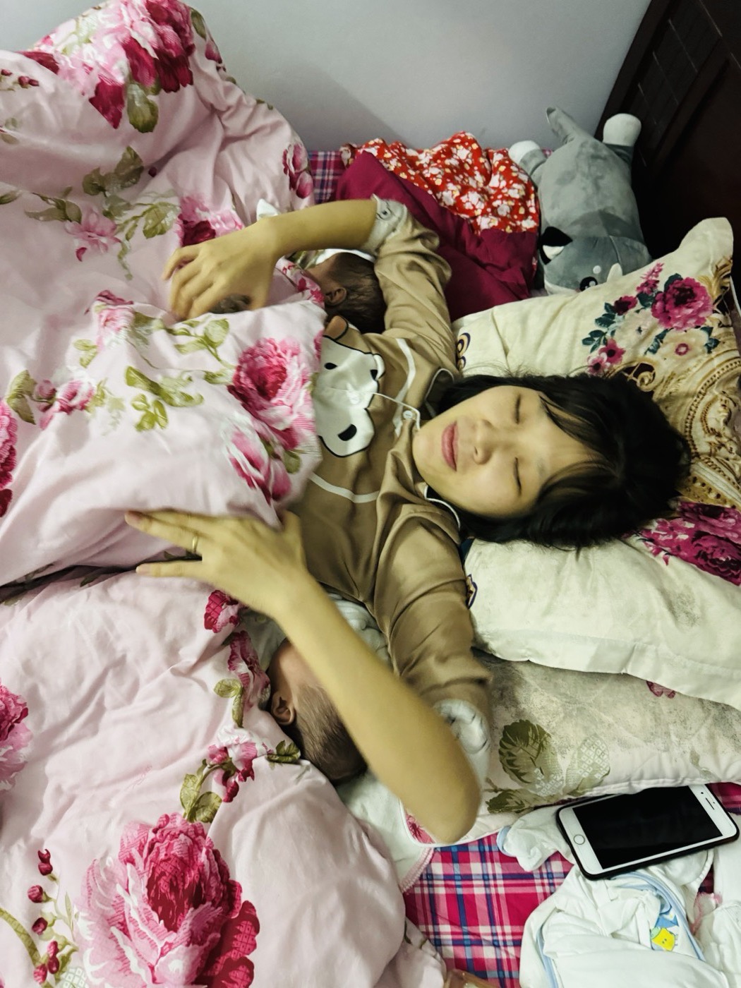 A tired parent resting at home with the little ones